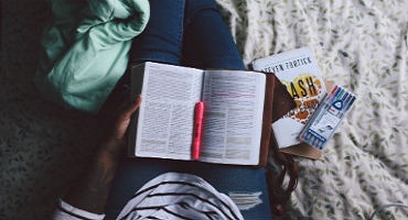 Woman reading and highlighting